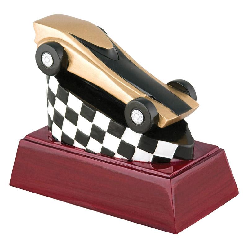 Pinewood derby car with flag on Rosewood Base