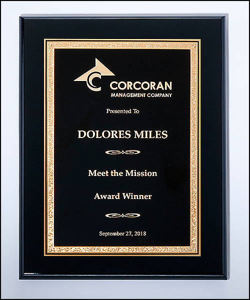 Black piano finish plaque complemented by an elegant black plate with gold florentine border.  Available in 3 sizes.