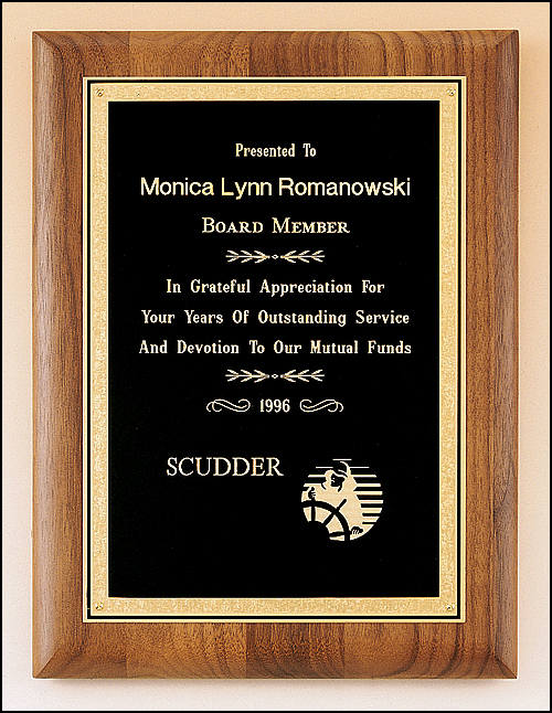 Walnut plaque with a precision elliptical edge with a black brass plate with florentine border. Available in 4 sizes.